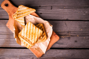 Crispy hot sandwiches with cheese, grilled