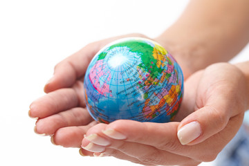 woman's hand with globe