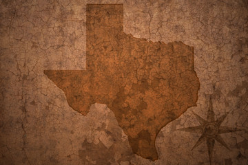 texas state map on a old vintage crack paper background