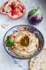 Arabic food baba ghanoush close-up on the plate and ingredients  the table. vertical