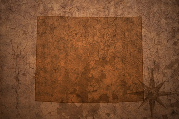 wyoming state map on a old vintage crack paper background
