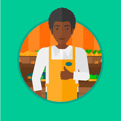 Friendly supermarket worker giving thumb.