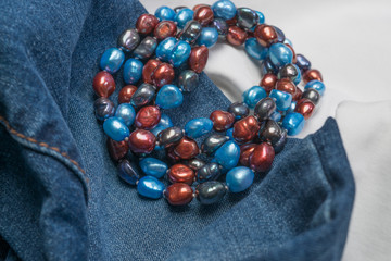 Rolled Bead Necklace on Denim and White Cloth