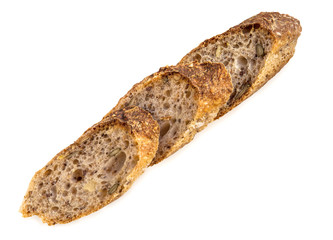 Slices of fresh homemade Alpine Baguette isolated over white.