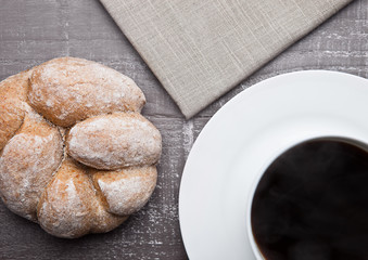 coffee cup with bread roll for breakfast morning