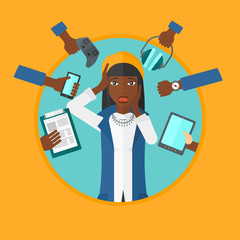 Young woman surrounded with her gadgets.