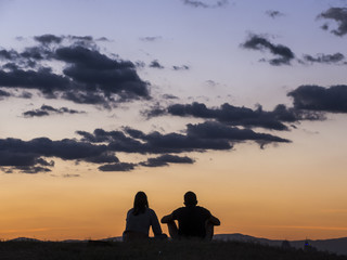 Fototapeta na wymiar couple watching the sunset