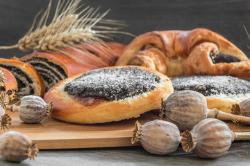poppy seed cake and strudel on a wooden board