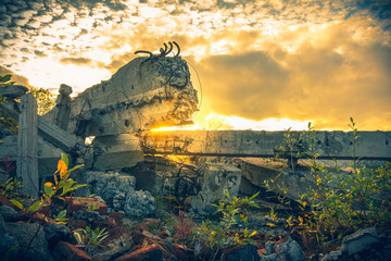 Old ruins of a building.The debris of the damaged building on sunset sky background