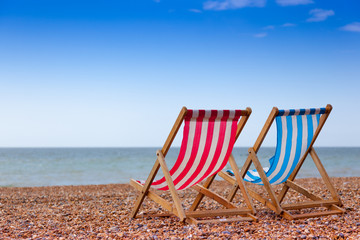 Lonely chaise lounges on the beach. Great Britain