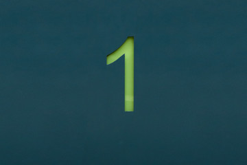 Grüne 1 auf petrolfarbenen Hintergrund