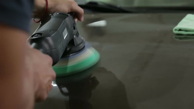 brown car is polishing