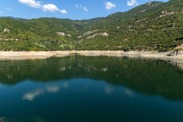 Fototapeta na wymiar Amazing ladscape with green forest around Vacha (Antonivanovtsy) Reservoir, Rhodopes Mountain, Bulgaria