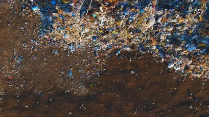 Aerial video: Non biodegradable garbage mountain - garbage dump.