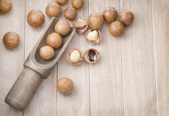 Macadamia Nuts and wooden spoon. Top view