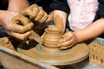 Potter at work. Potter's wheel. Working potter.