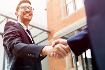 Two businessmen shaking their hands