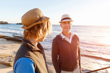 Senior man fishing with his grandson
