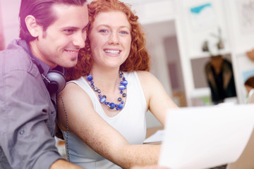 Two young people in office