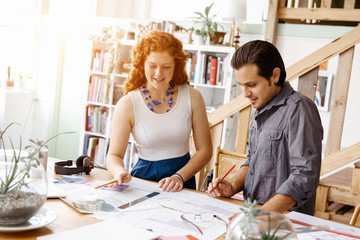 Fototapeta premium Two young architects in office