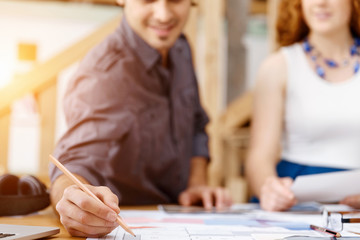 Two young architects in office