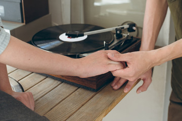 man tenderly keep his girlfriends hand