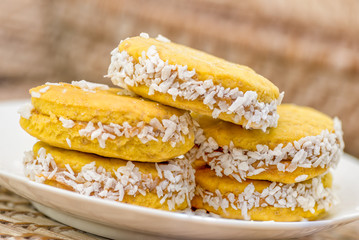 Vegan sweet biscuits with coconut on a white plate