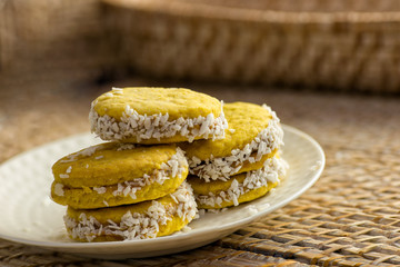 Vegan sweet biscuits with coconut on a white plate
