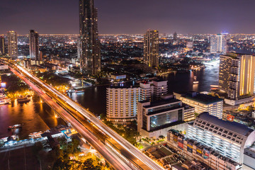 Fototapeta na wymiar Bangkok Transportation with Modern Business Building along the river (Thailand)
