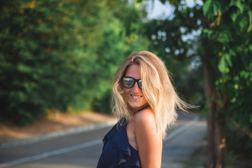 beautiful sunny portrait of a girl. Face laughing girl on beach