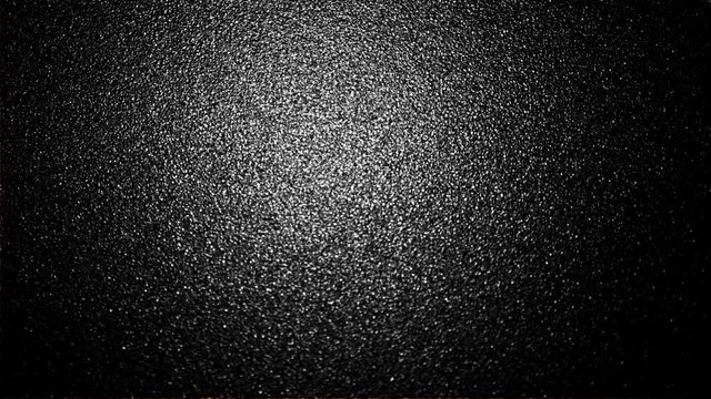 An abstract textured background with light flickering.