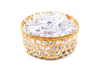 Fototapeta na wymiar pieces of paper as a bumper in handmade bamboo basket