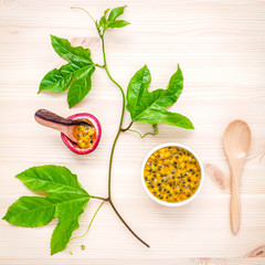 Fresh passion fruits set up on wooden background. Juicy passion
