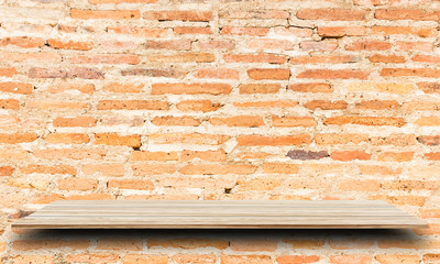 Empty top wooden shelves and brick wall background. For product