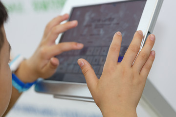 Children's hands and tablet computers - 122203789