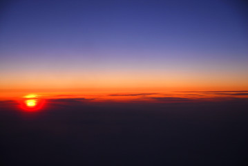 sunrise from horizon seen from air plane in the sky