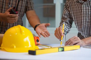 Hands male architect to make drawings using various line pencil and compass
