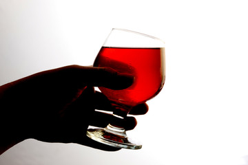 Hand holding a glass of wine