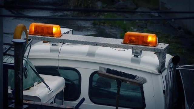 Lights Flashing On Repair Vehicle In Rain