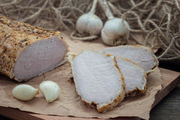 smoked meat with spices on a wooden table