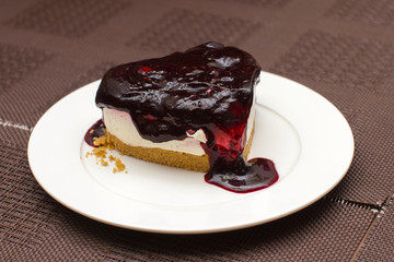 slice cheesecake with  blackberry  jam
