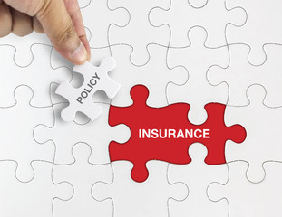 White puzzle with word INSURANCE and POLICY.