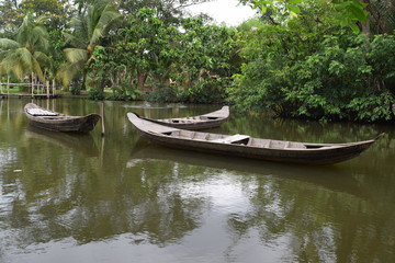 Naklejka na ściany i meble traditional asian fishing boat in river