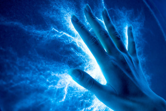 The touch of the hand to the luminous electric surface-emitting