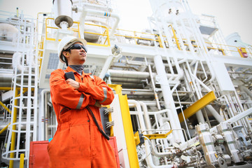 operator recording operation of oil and gas process at oil and rig plant, offshore oil and gas...