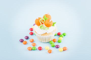 Halloween cupcake with colored decorations