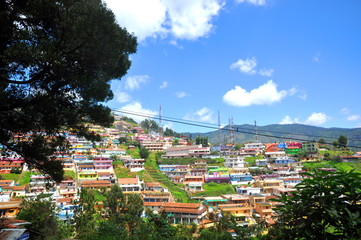 Ooty landscape with mountains and blue skies. Ooty is located in Nilgiris range in Tamil Nadu, India.