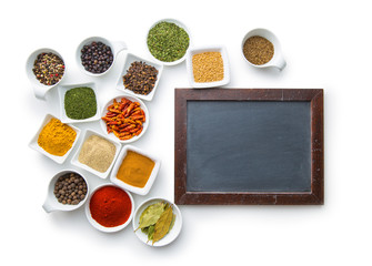 Blank chalkboard and various spices.