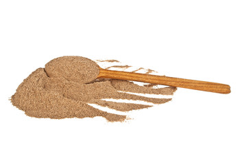 Cinnamon spice and wooden spoon isolated on a white background