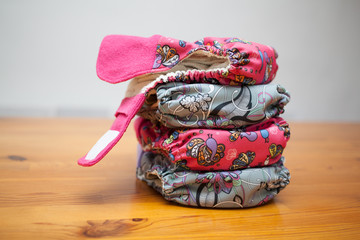 Stack of cloth diapers on a wooden table